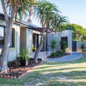 59onLetchworth: a house with palm trees in a yard