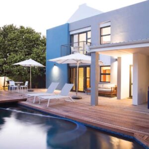 7 Ackermann Place Guest House: a house with a wooden deck and a swimming pool