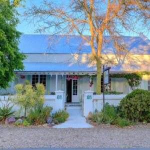 81 on Church Guest House: a white house with a white fence