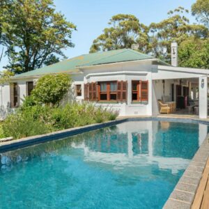 Abbotts Hill: a swimming pool in front of a house