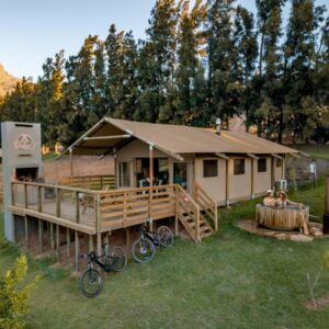 AfriCamps at Doolhof Wine Estate: a cabin with bikes parked in front of it