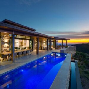 Alkira Luxury Lodge and Villa: a villa with a swimming pool at dusk