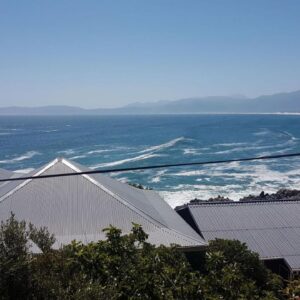Amazing Grace B&B: a view of the roofs of buildings and the ocean