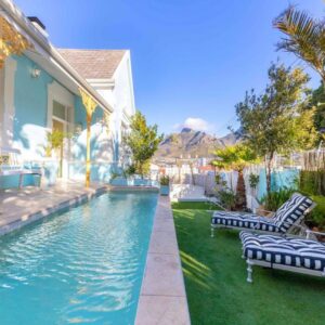 Amina Boutique Hotel: a house with a swimming pool next to a house