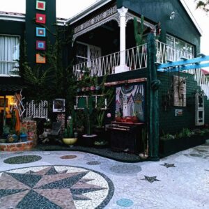 Anna's House of Arts: a building with a tile courtyard with a balcony
