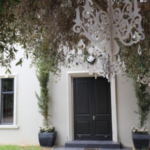Another World - Montagu: a white house with a black door and trees