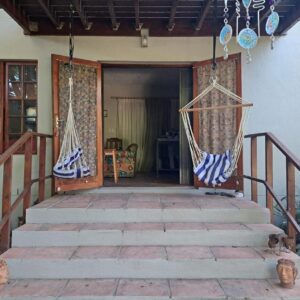 Apple Pie Self-catering: a house with two hammocks on the front porch