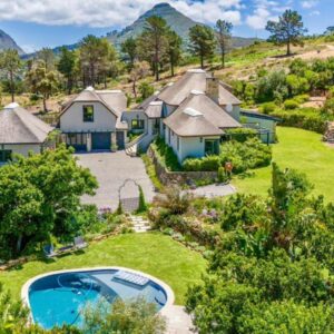 Beau's Cape Retreat: an aerial view of a house with a pool in the yard