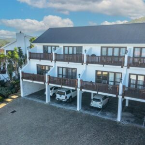 BergWood Inn: an aerial view of a white house with a balcony