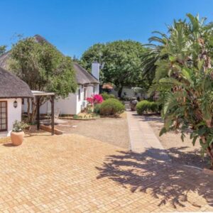 Beulah Lodge: a courtyard of a house with a brick driveway