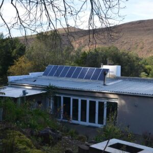 Bibi's Joy: a house with a solar panel on the roof