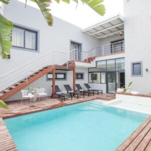 Bliss Boutique Hotel: an image of a house with a swimming pool