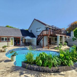 Branch & Vine Cottages - Constantia: a house with a swimming pool in a yard