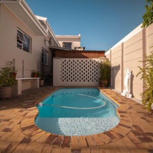 Broadway Tygervalley House: a swimming pool in the backyard of a house