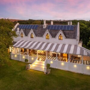 Caledon Grace Guesthouse: an aerial view of a house with solar panels on it