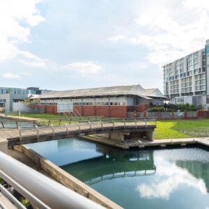 Canal Quays Apartments: a bridge over a river in a city with buildings