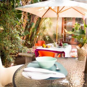 Cape Nelson Guest House: a table with a bowl on it on a patio