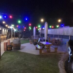Chai & Spice Guesthouse: a patio at night with lights on a building