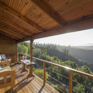 Cliffhanger Cottages: a balcony of a cabin with a view of the mountains