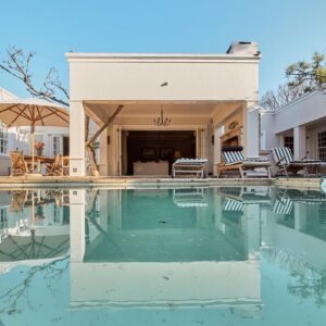 Dalton House: a swimming pool in front of a house
