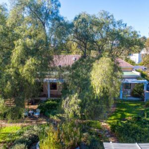 Darling Lodge Guest House: an aerial view of a house with trees