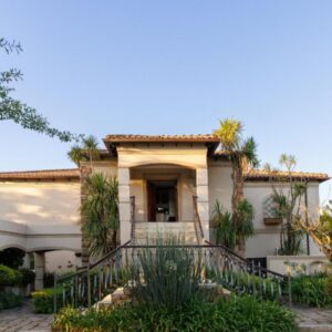 Dawn Mountains Estate: a house with a staircase in front of it