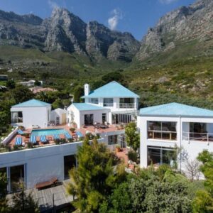 Diamond House Guesthouse: an aerial view of a house with mountains in the background