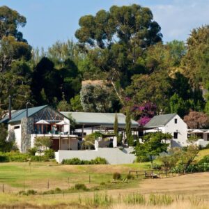 Diemersfontein Wine & Country Estate: a large white house with trees in the background