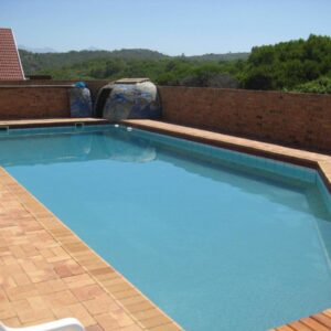 Dolphins View Self Catering Guesthouse: a large swimming pool on top of a building
