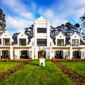 Fairview House: a large white house with a lawn in front of it