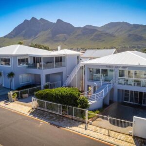 Footprints in Kleinmond: an aerial view of a house with mountains in the background