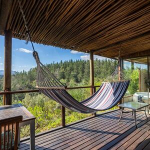 Forest Valley Cottages: a hammock on the deck of a house with a view