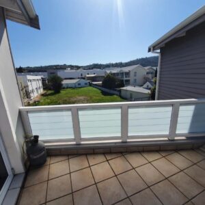 Friendz Self Catering Guesthouse: a balcony with white railings on a house