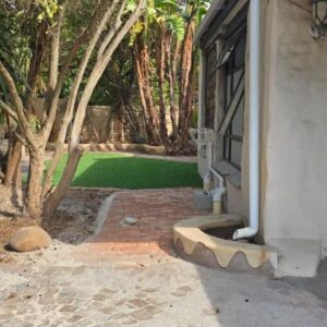 Grand Nest Boutique Guest House: an open door of a house with a yard