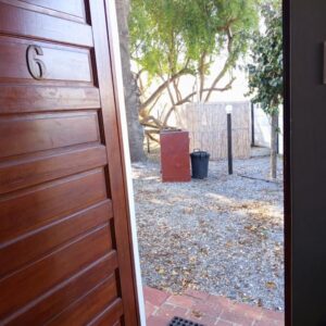 Green Olive Guesthouse: an open door with a view of a yard
