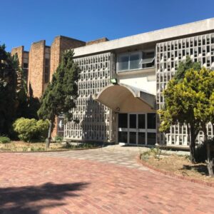 Green Point Self Catering Studios: a building with a brick driveway in front of it