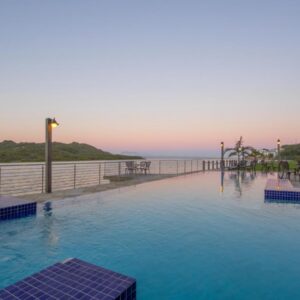 Hartenbos Lagoon Resort by Dream Resorts: a hotel swimming pool with a view of the ocean