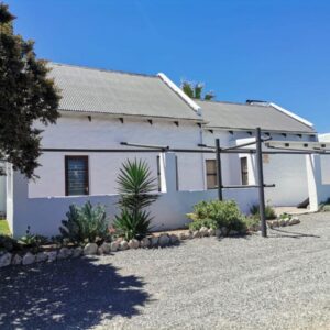 Harts Water: a white house with a gravel driveway