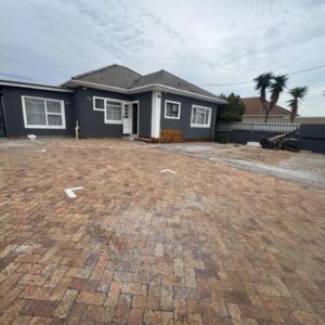 HavenTrust Guest house: a house with a brick driveway in front of it