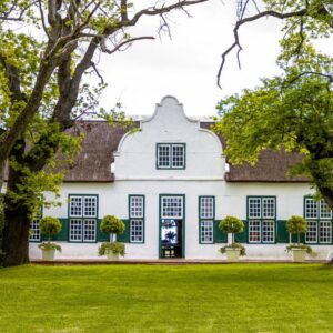Hawksmoor House: an exterior view of a white house with trees