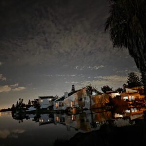 Heaven: a view of a house on the water at night