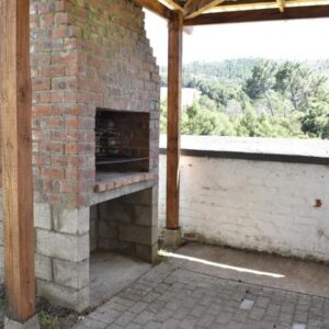 Herold Wines Accommodation: an outdoor brick oven sitting on top of a building