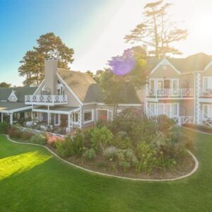 Hilltop Boutique Hotel: an aerial view of a large house with a yard