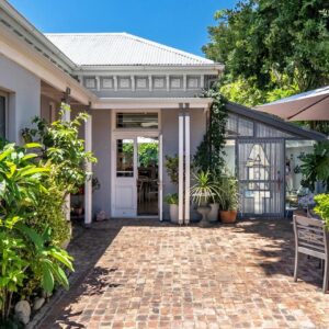 Himmelblau Boutique Bed and Breakfast: a house with a brick pathway leading to the front door