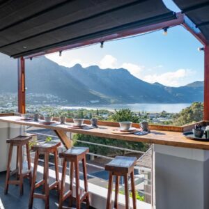 Hout & About Guest House: a bar on the balcony of a house with a view