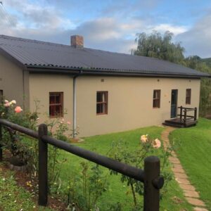 Inn On Highlands: a white house with a fence in front of it