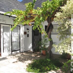 Invergara: a front door of a white house with a tree