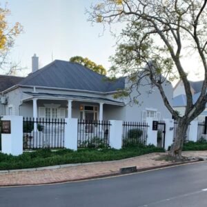 Just Joey Lodge: a white house with a black roof and a fence