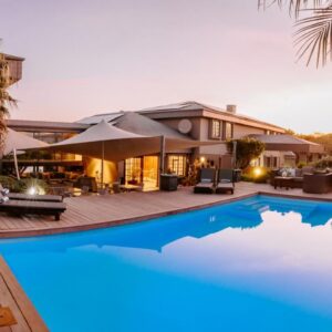 Kanonkop House: a swimming pool in front of a house