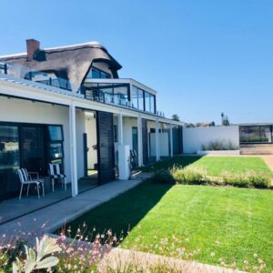 Karee Manor Guesthouse: a view of a house with a yard